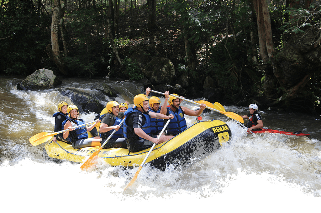 People Rafting down river